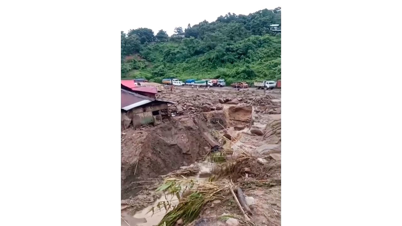 <div class="paragraphs"><p>Houses and major portions of National Highway-29, connecting Kohima with commercial hub Dimapur, damaged after heavy rainfall, in Chumoukedima district of Nagaland, Wednesday.</p></div>